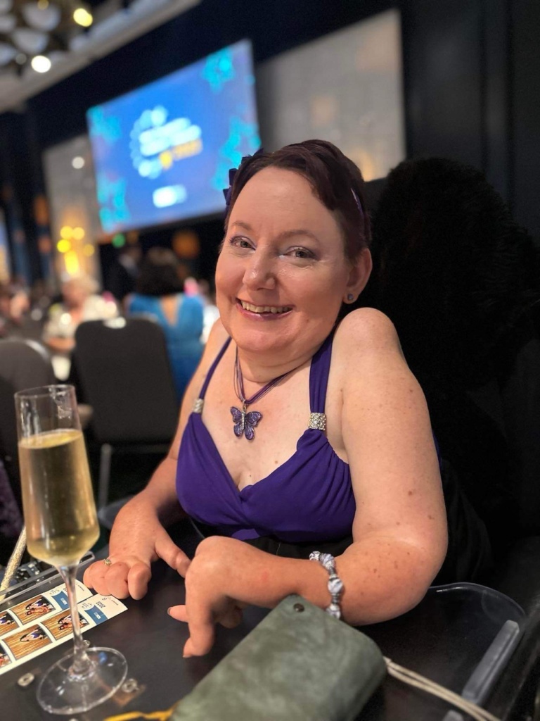 Melanie enjoying a night out at a formal event